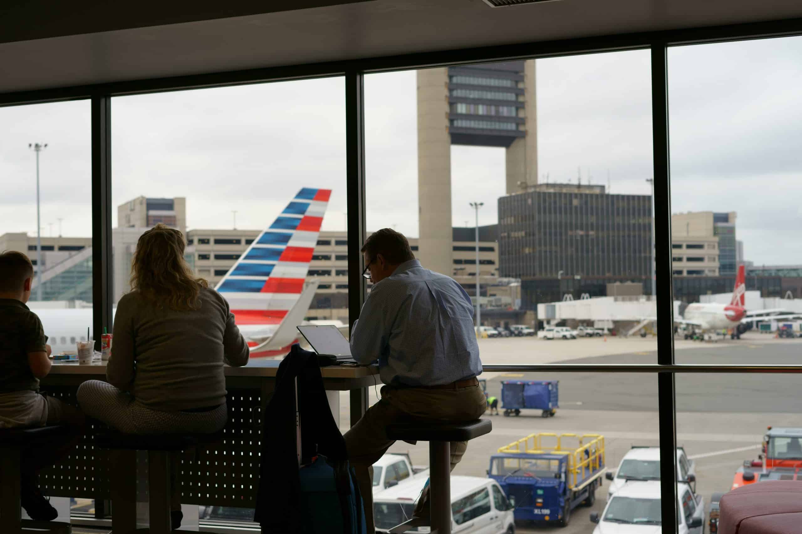 business travel eSIM image of traveling people working in an airport